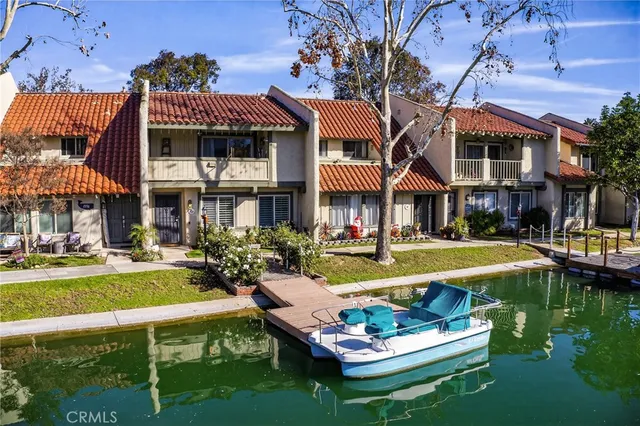 a front view of a house with swimming pool having outdoor seating