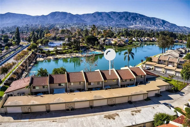 an aerial view of a house with a yard
