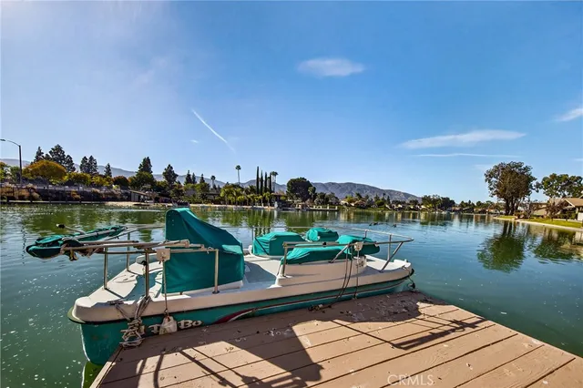 a view of a lake with a table and chairs