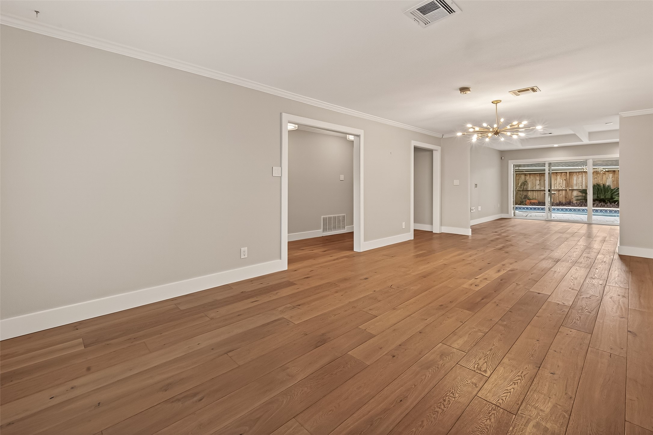 5310 Spellman Road Houston, TX 77096 - Photo 15 of 48 a view of an empty room with wooden floor and a window