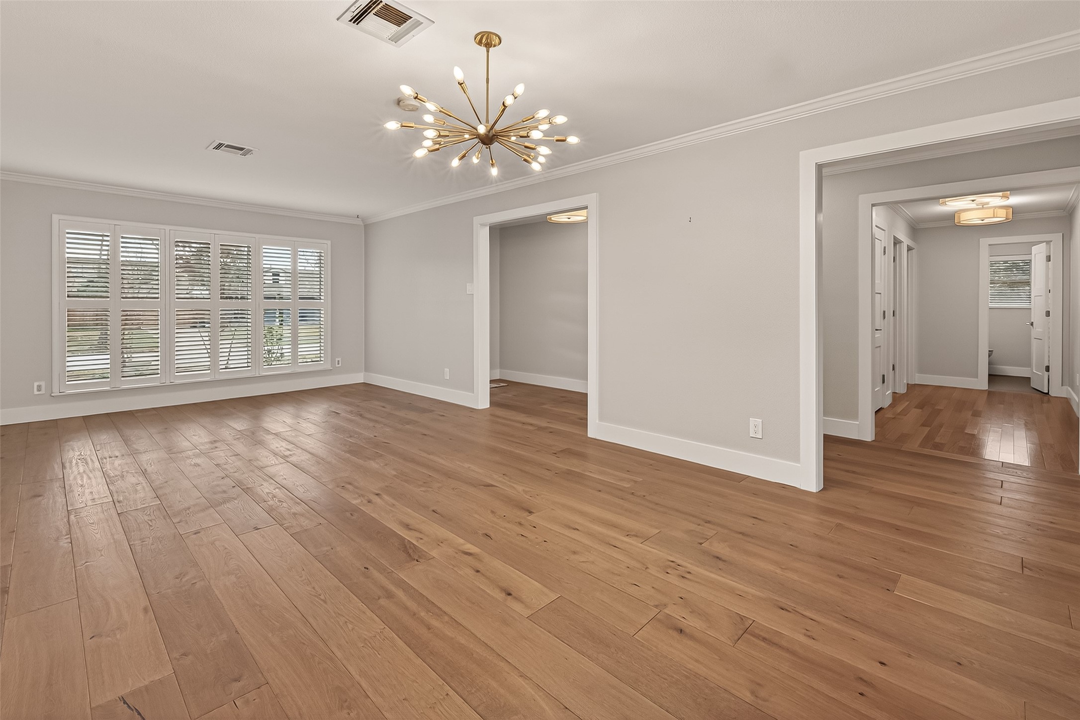 5310 Spellman Road Houston, TX 77096 - Photo 16 of 48 a view of an empty room with wooden floor and a window