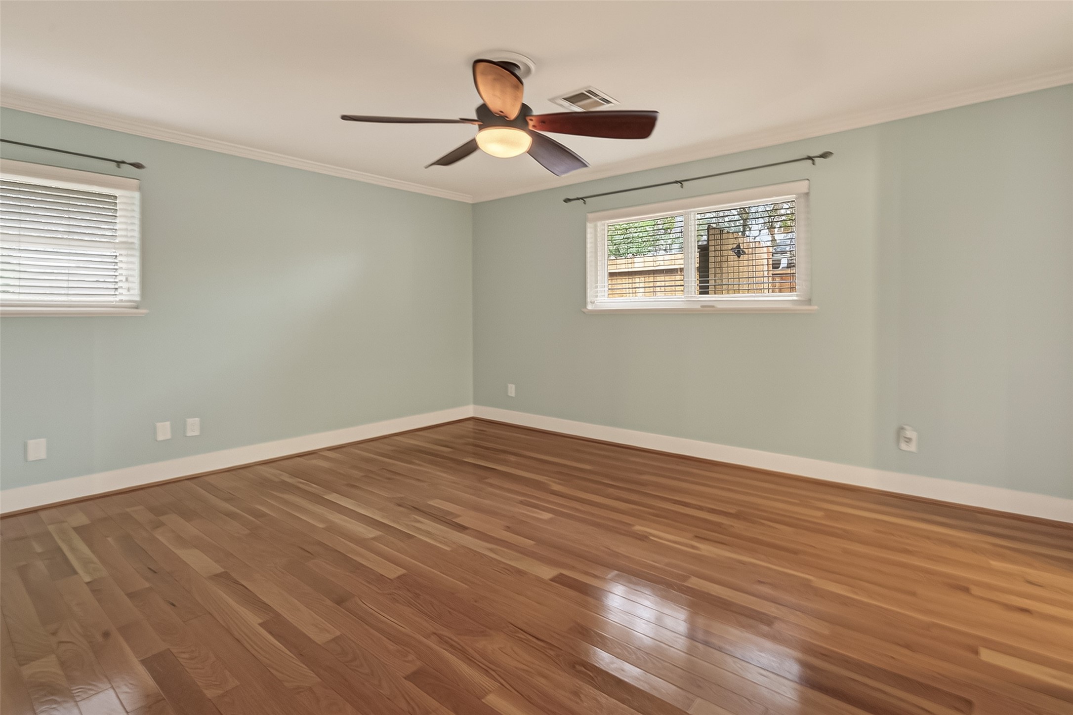 5310 Spellman Road Houston, TX 77096 - Photo 22 of 48 a view of empty room with wooden floor and fan