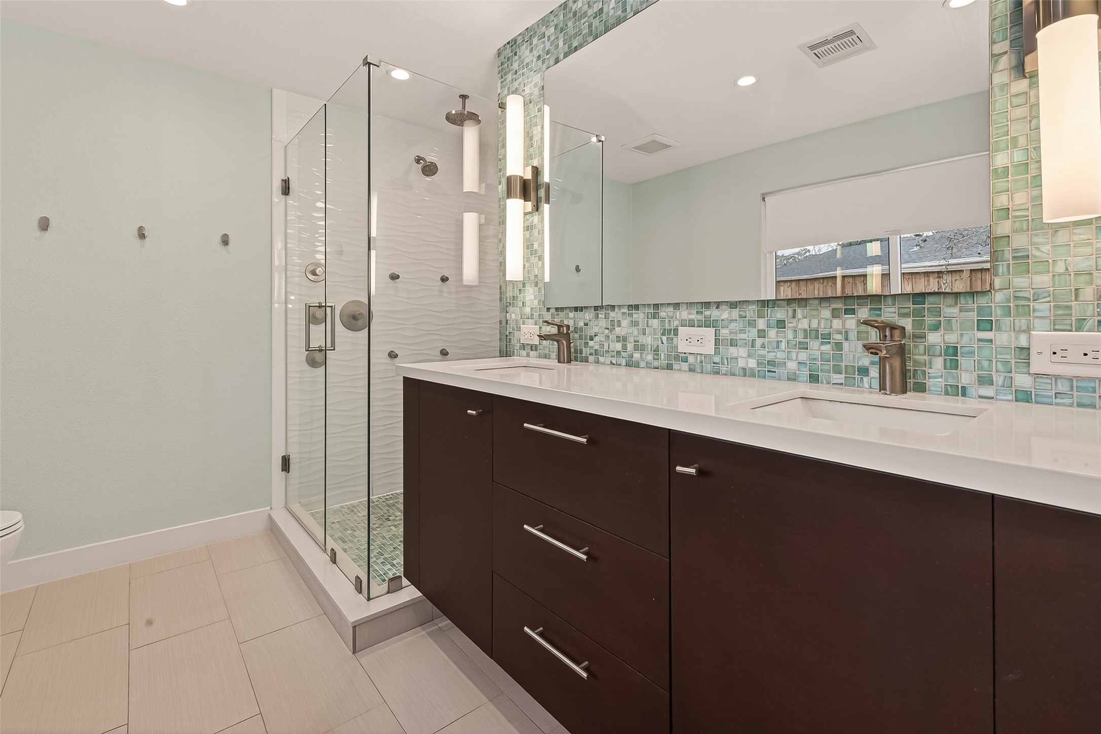5310 Spellman Road Houston, TX 77096 - Photo 25 of 48 a bathroom with a double vanity sink mirror and shower