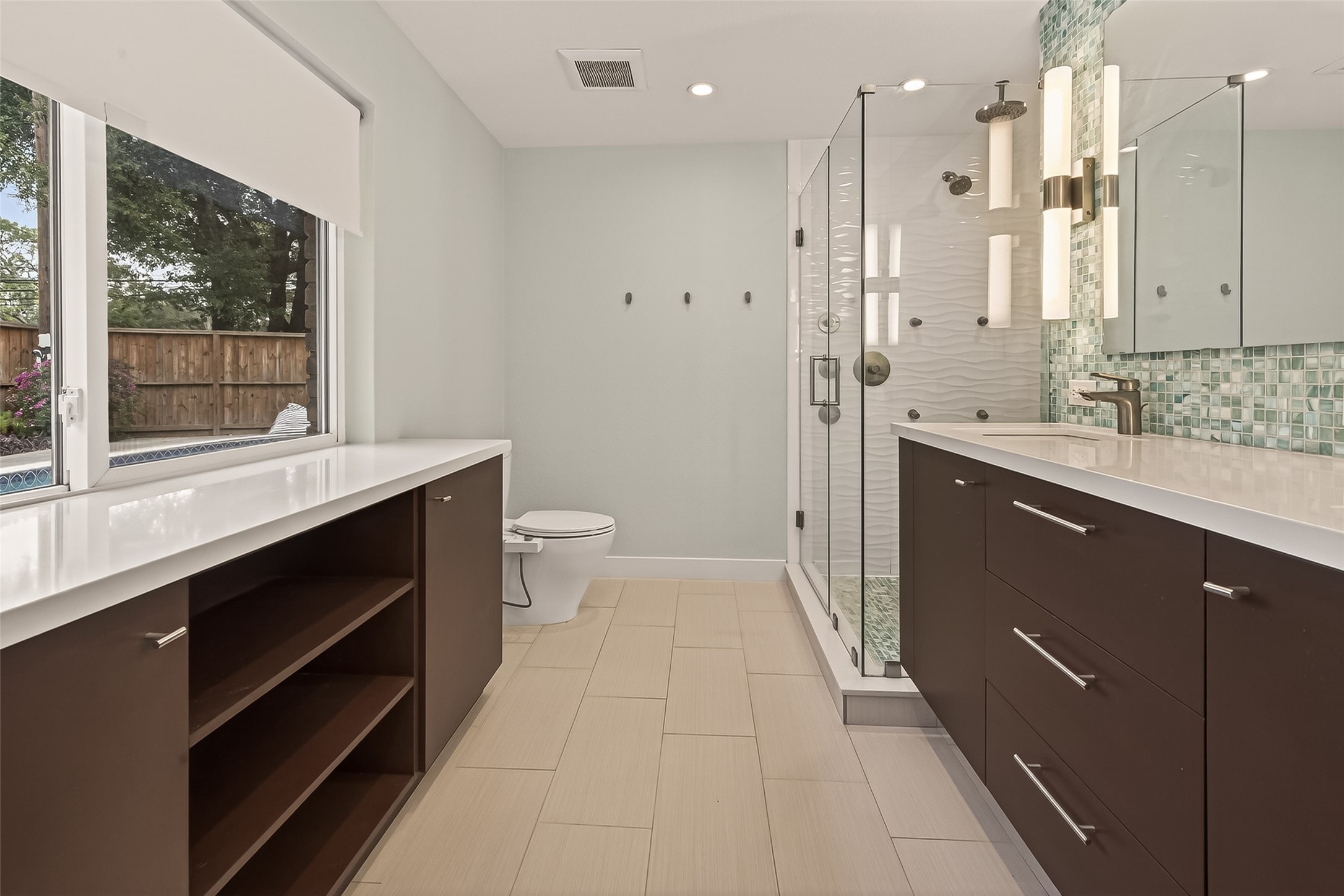 5310 Spellman Road Houston, TX 77096 - Photo 26 of 48 a bathroom with a sink a toilet a large mirror and a shower