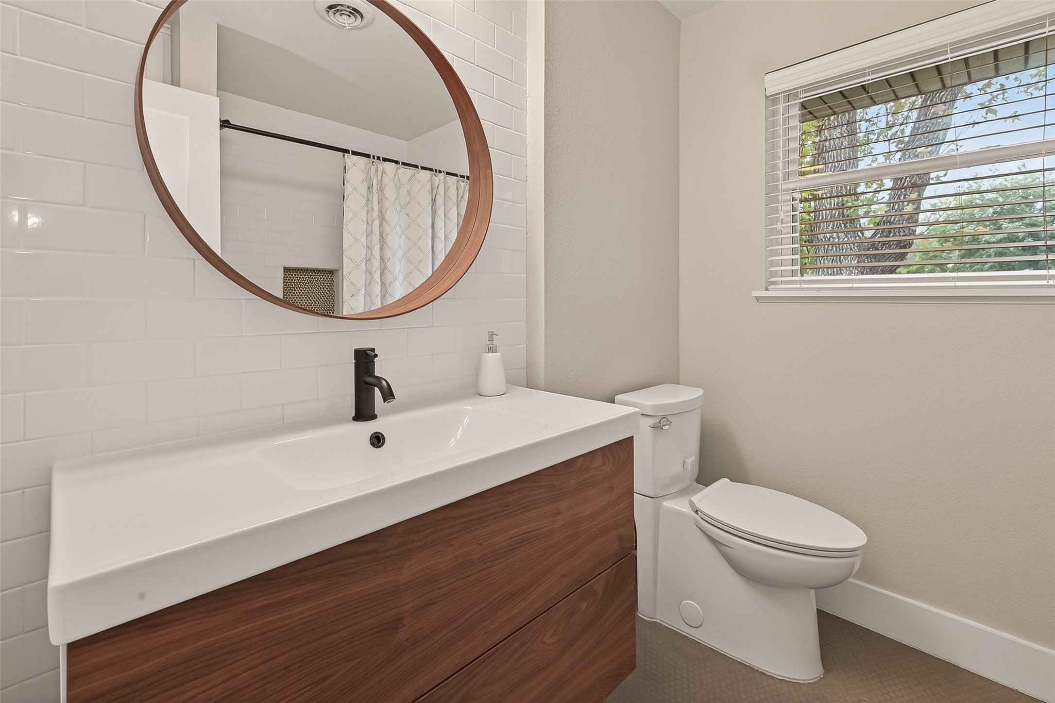 5310 Spellman Road Houston, TX 77096 - Photo 31 of 48 a bathroom with a sink a toilet and a mirror