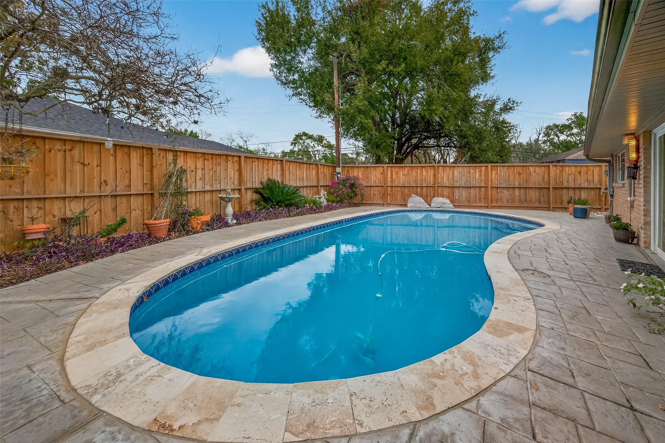 5310 Spellman Road Houston, TX 77096 - Photo 40 of 48 a view of a swimming pool with an outdoor seating