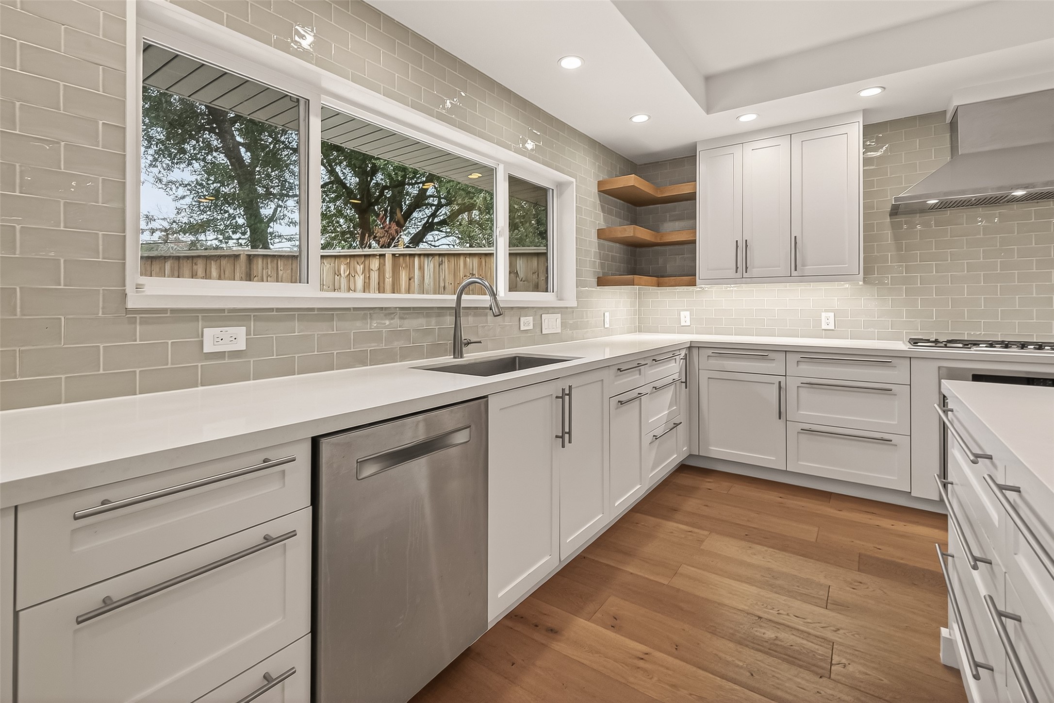 5310 Spellman Road Houston, TX 77096 - Photo 4 of 48 a kitchen with a sink cabinets and window