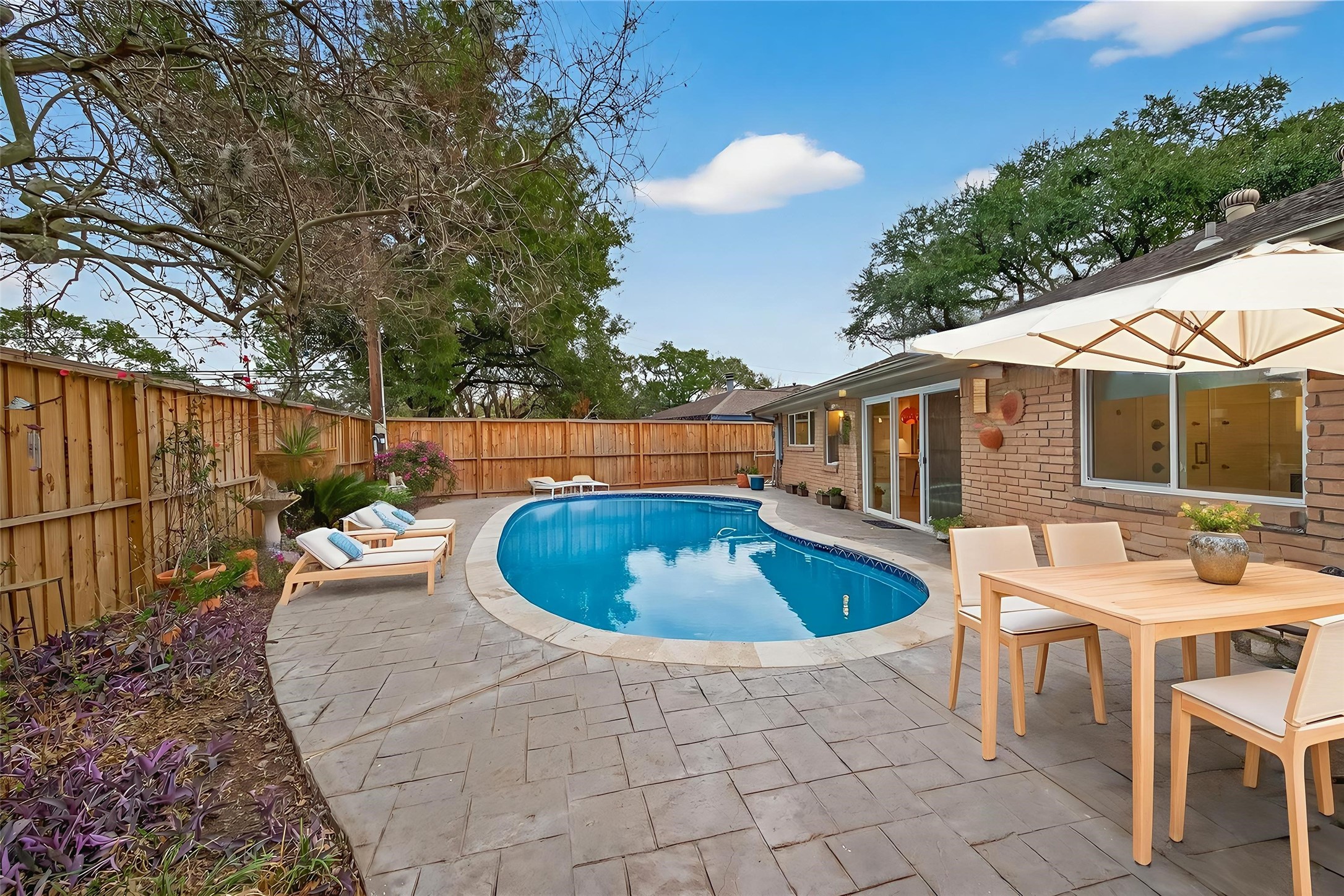 5310 Spellman Road Houston, TX 77096 - Photo 42 of 48 a view of a backyard with swimming pool and furniture