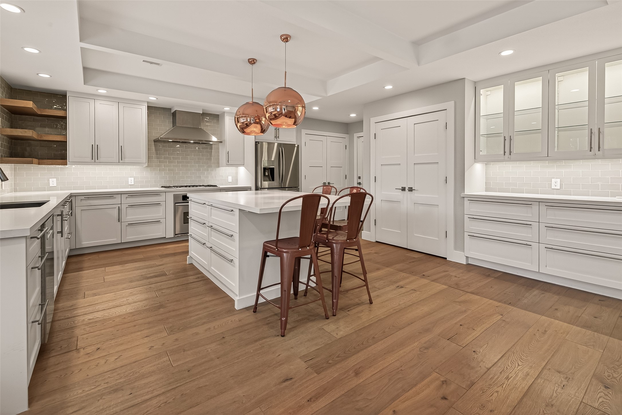 5310 Spellman Road Houston, TX 77096 - Photo 5 of 48 a kitchen with a table chairs and white cabinets