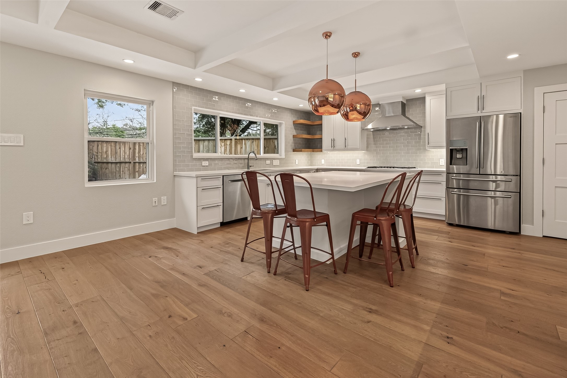 5310 Spellman Road Houston, TX 77096 - Photo 6 of 48 a kitchen with stainless steel appliances granite countertop a kitchen island a stove a table and a refrigerator