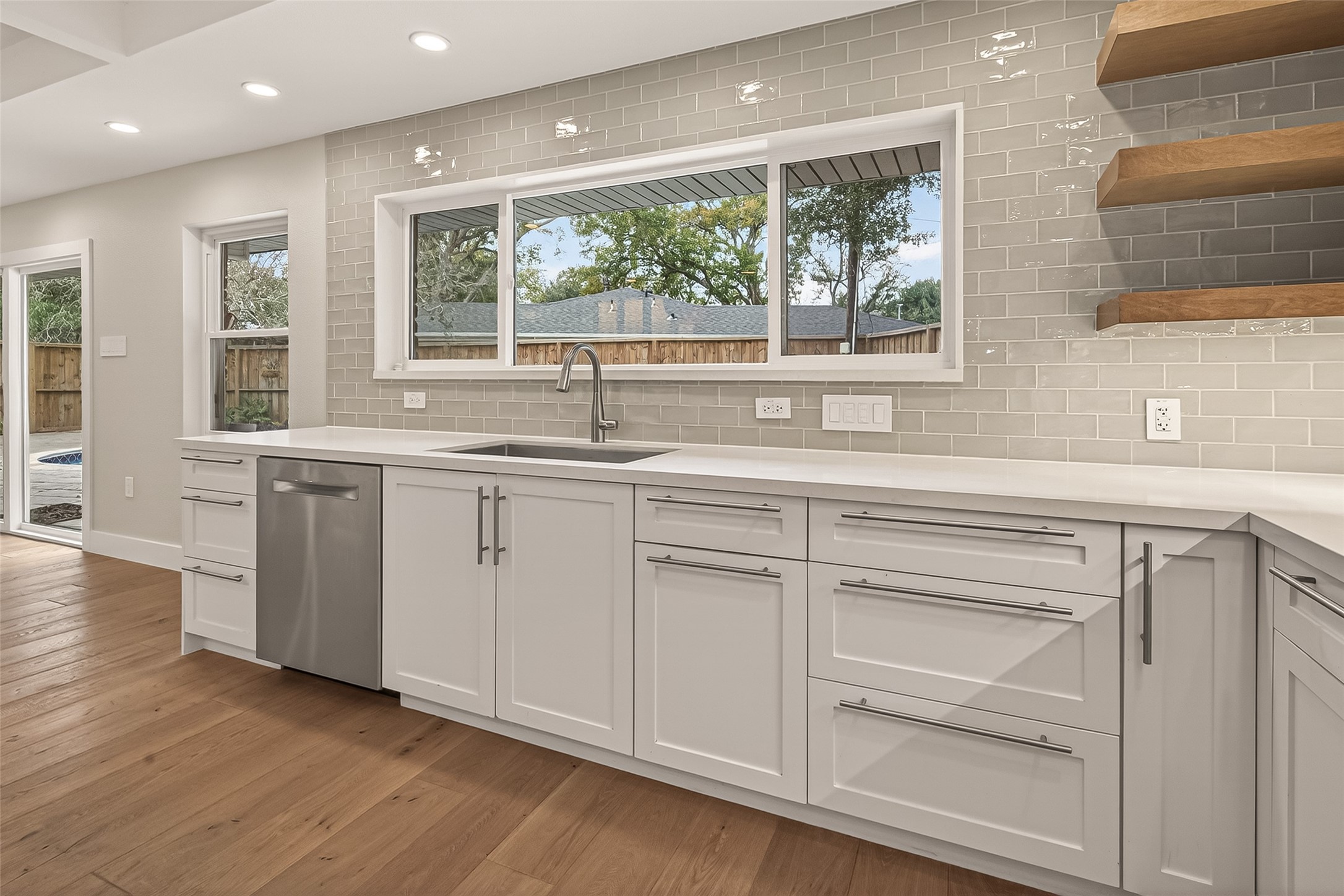 5310 Spellman Road Houston, TX 77096 - Photo 9 of 48 a kitchen with a sink and large window