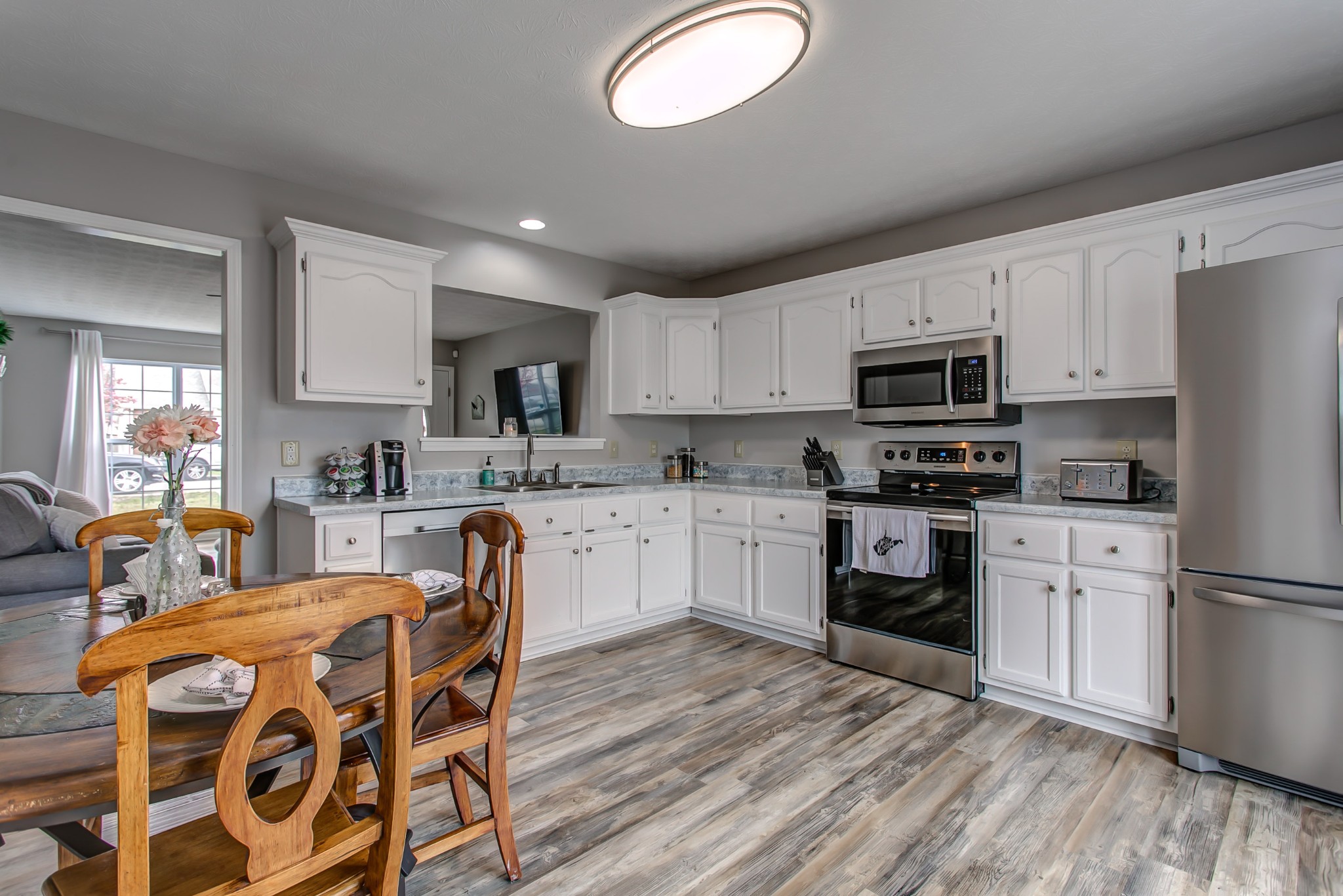 332 Bandera Lane Springfield, TN 37172 - Photo 11 of 22 a kitchen with granite countertop a sink cabinets stainless steel appliances and a window