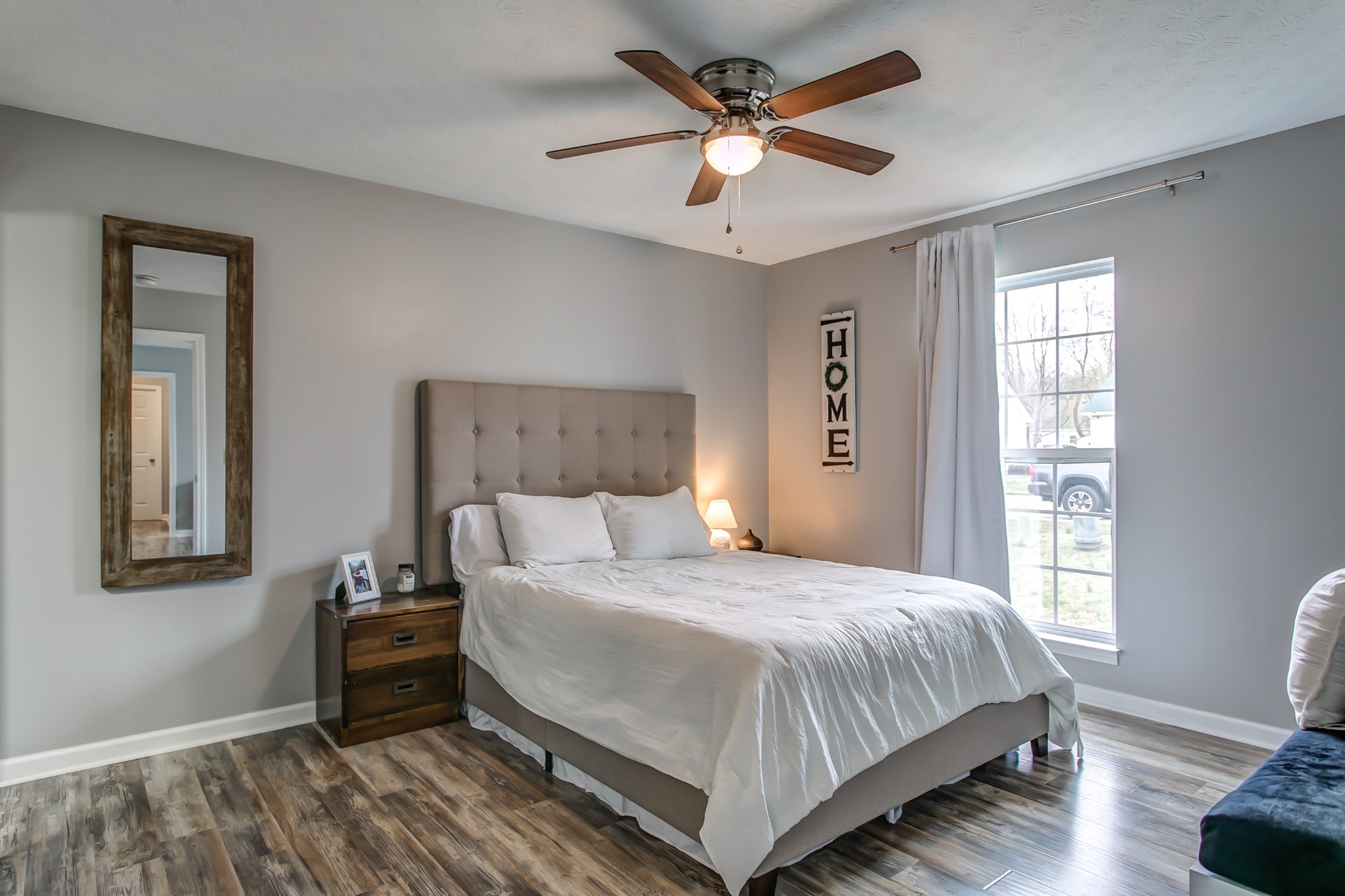 332 Bandera Lane Springfield, TN 37172 - Photo 16 of 22 a bedroom with a bed chandelier and a window