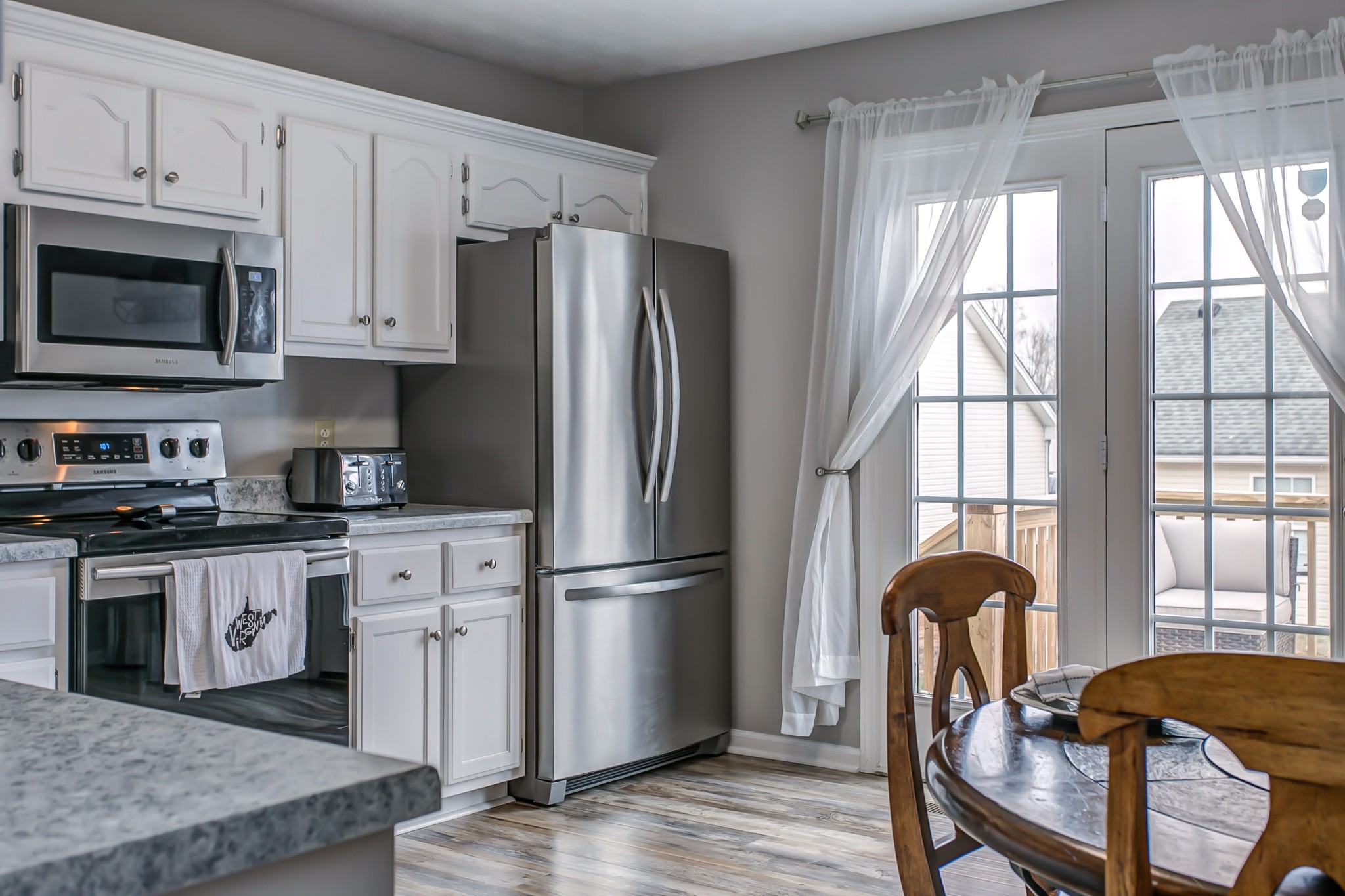 332 Bandera Lane Springfield, TN 37172 - Photo 8 of 22 a kitchen with stainless steel appliances granite countertop a refrigerator sink and stove
