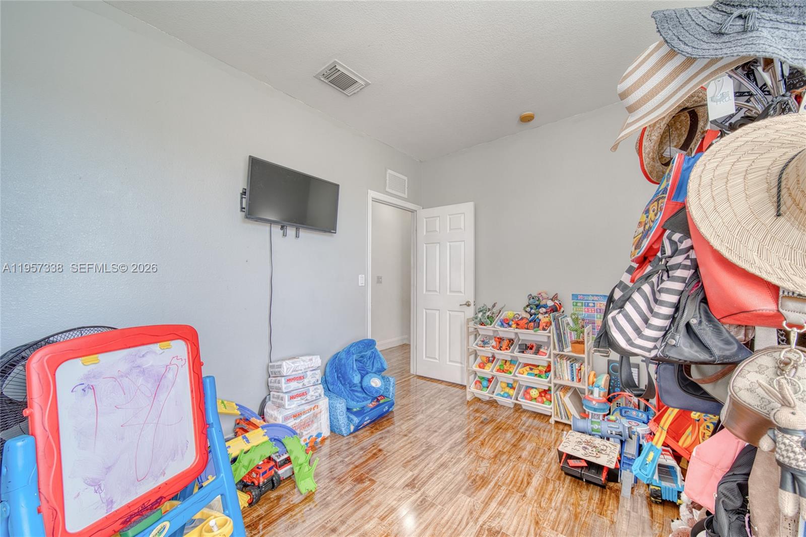 13771 Southwest 274th Terrace Homestead, FL 33032 - Photo 18 of 35 a room with toys and a wooden floor