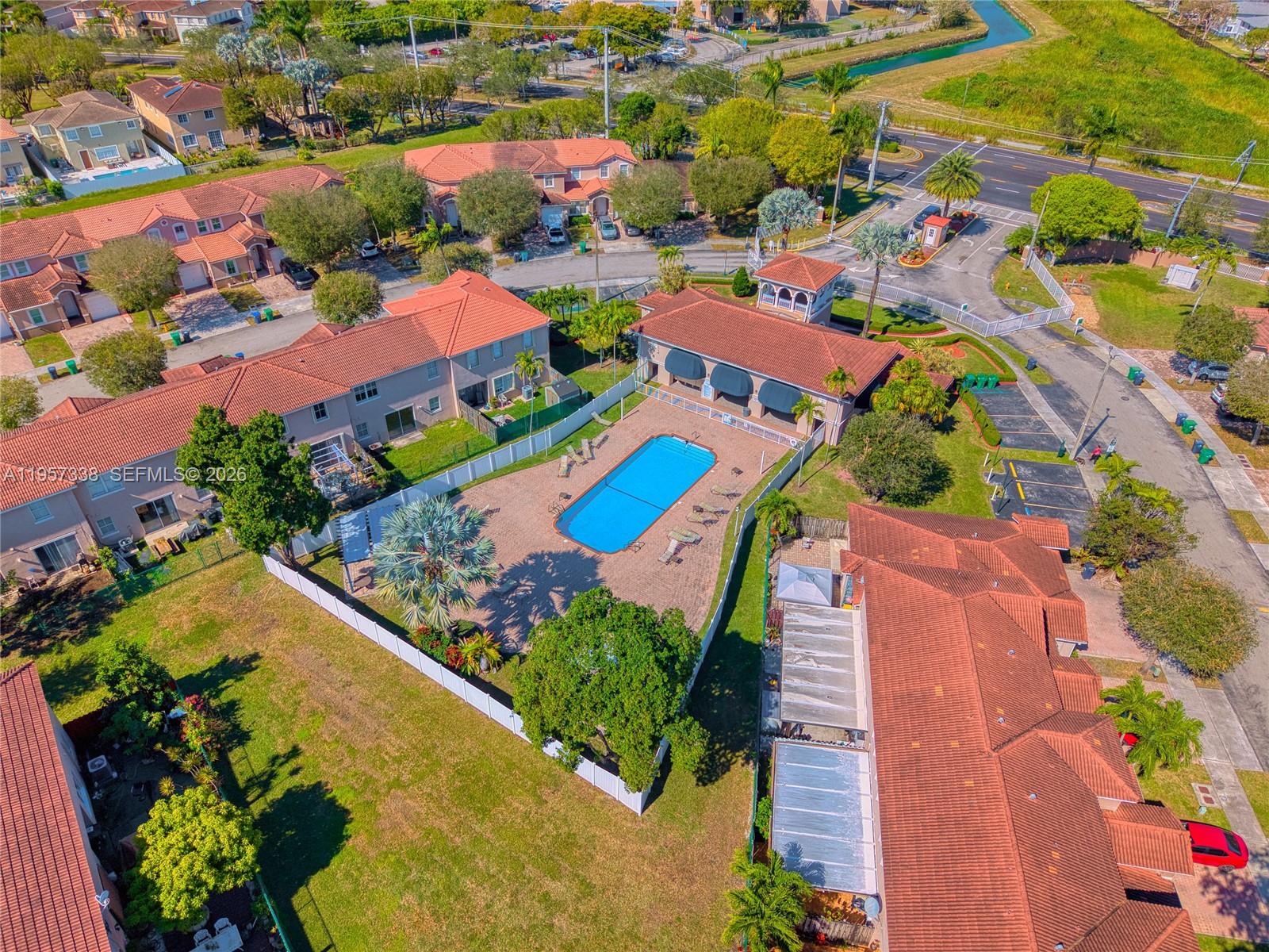 13771 Southwest 274th Terrace Homestead, FL 33032 - Photo 29 of 35 an aerial view of residential houses with outdoor space