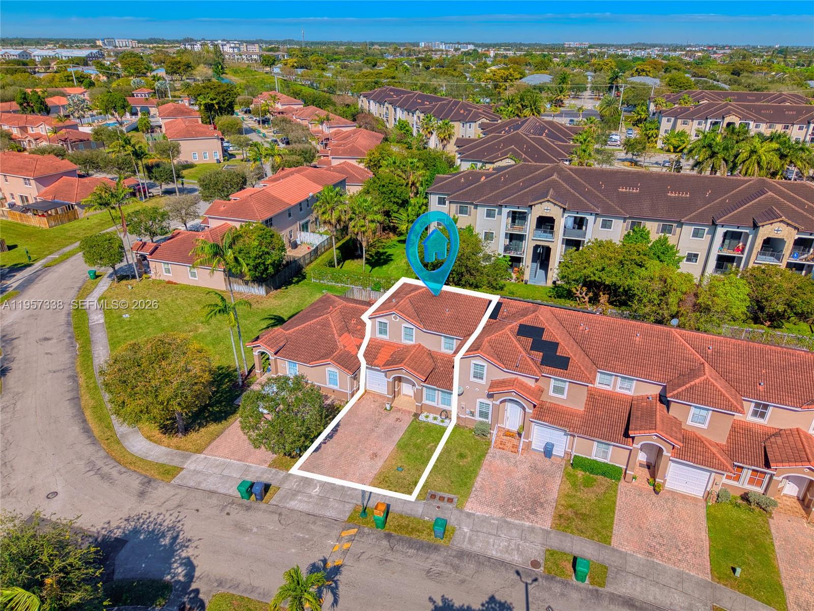 13771 Southwest 274th Terrace Homestead, FL 33032 - Photo 31 of 35 an aerial view of residential houses with outdoor space and parking