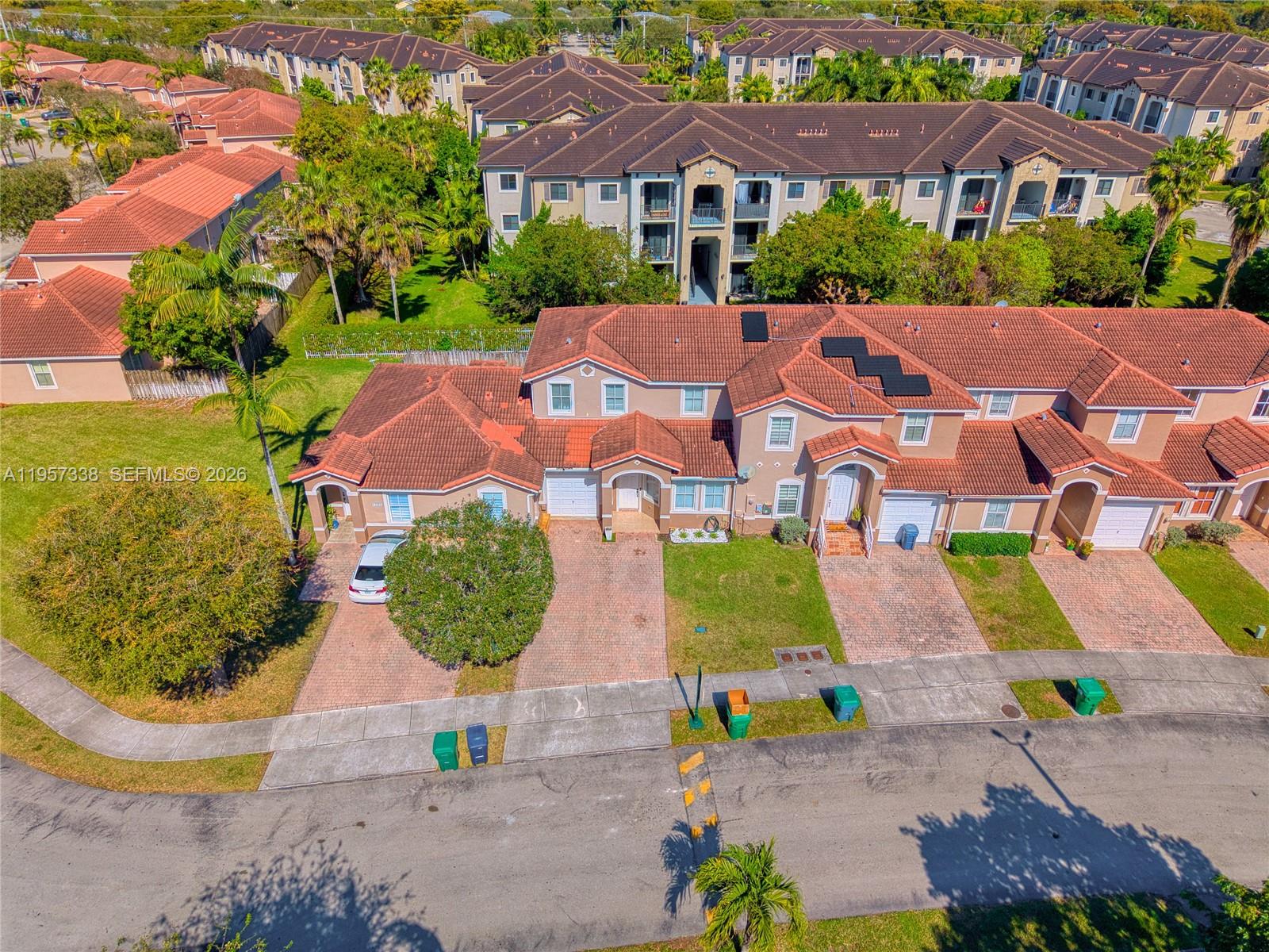 13771 Southwest 274th Terrace Homestead, FL 33032 - Photo 35 of 35 an aerial view of multiple houses with yard