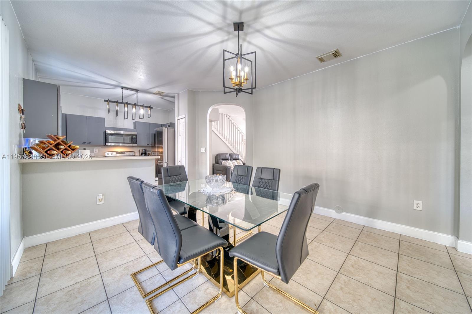 13771 Southwest 274th Terrace Homestead, FL 33032 - Photo 8 of 35 a dining room with furniture and window