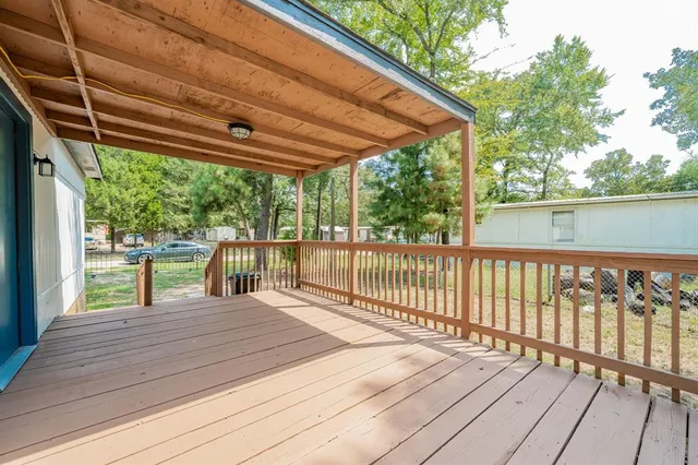 a view of porch with wooden floor and outdoor seating
