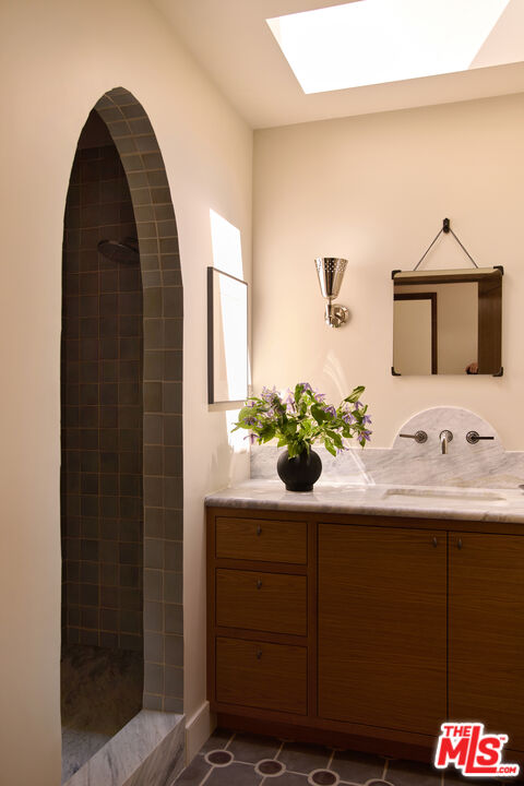 1764 East Orange Grove Boulevard Pasadena, CA 91104 - Photo 14 of 29 a bathroom with a sink and a mirror