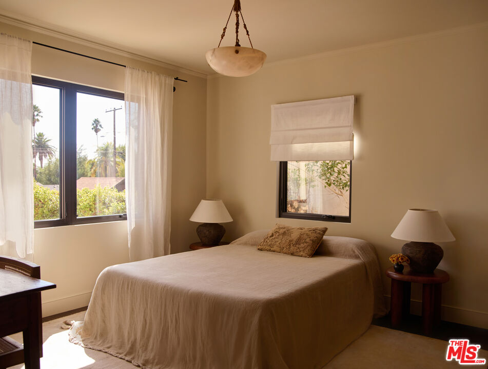 1764 East Orange Grove Boulevard Pasadena, CA 91104 - Photo 16 of 29 a bedroom with a bed and a window