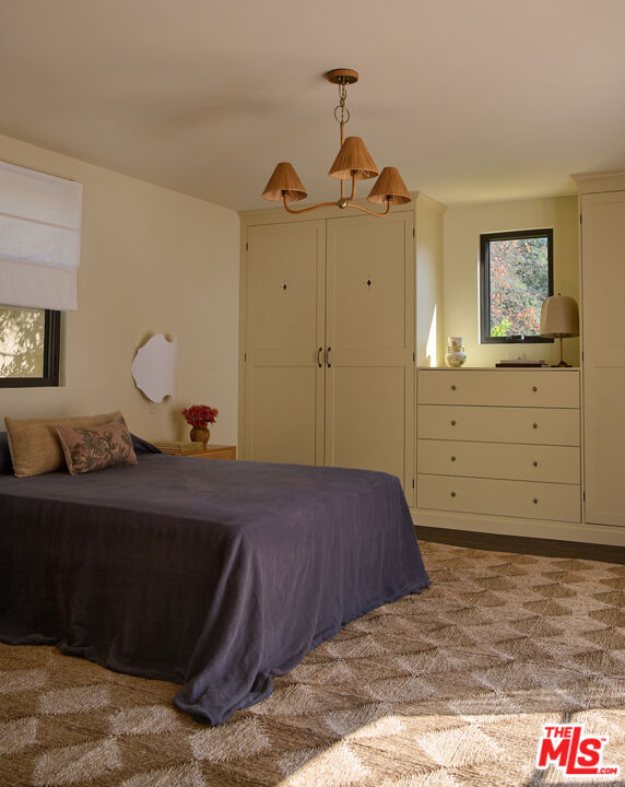 1764 East Orange Grove Boulevard Pasadena, CA 91104 - Photo 18 of 29 a bedroom with a bed and a dresser