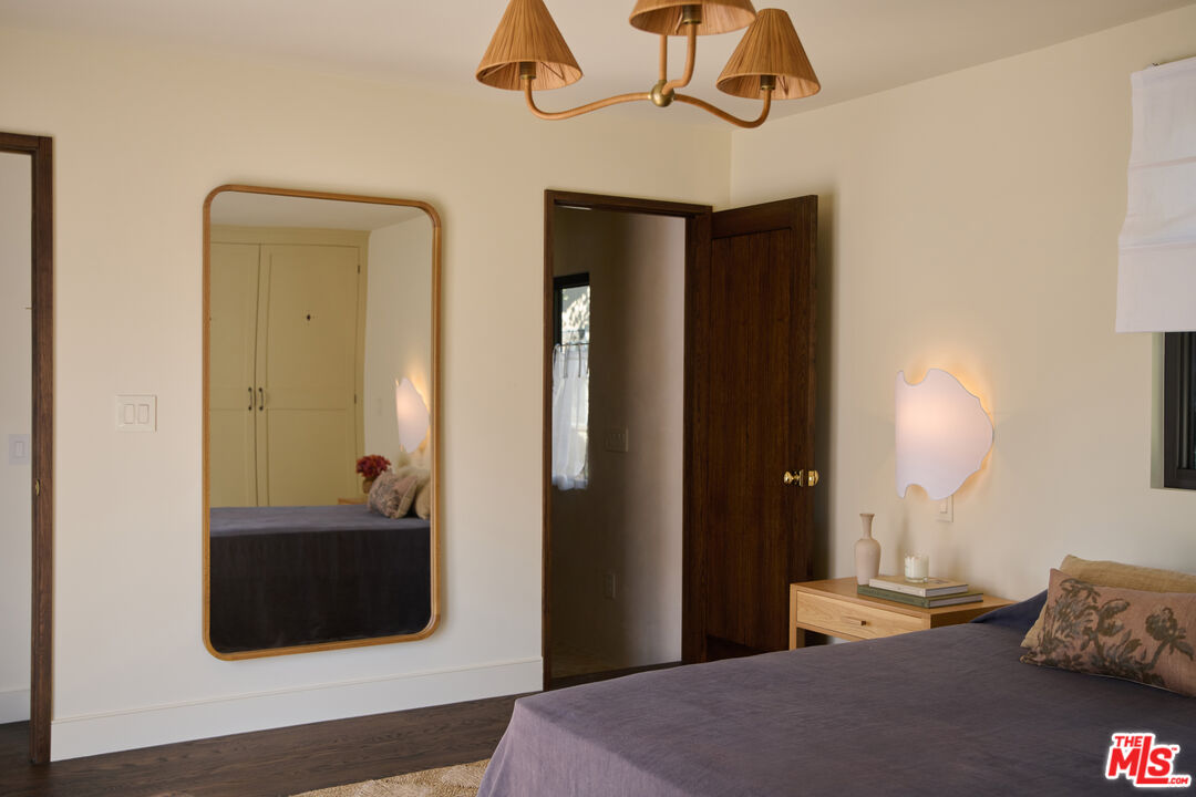 1764 East Orange Grove Boulevard Pasadena, CA 91104 - Photo 19 of 29 a bedroom with a bed and a mirror