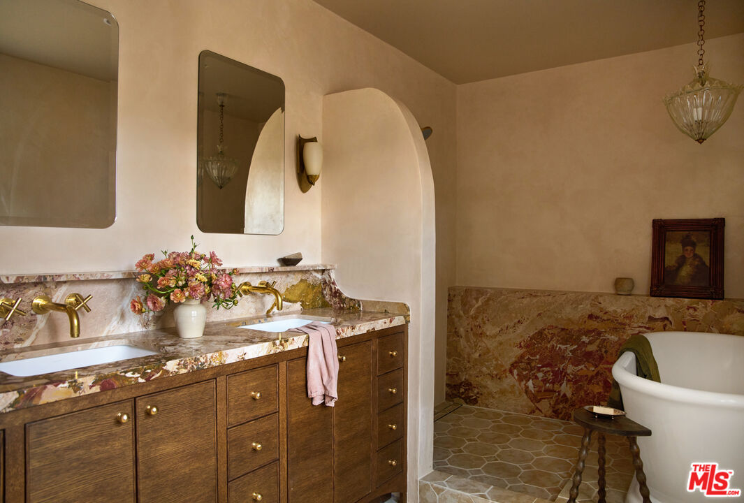 1764 East Orange Grove Boulevard Pasadena, CA 91104 - Photo 20 of 29 a bathroom with a sink and a mirror