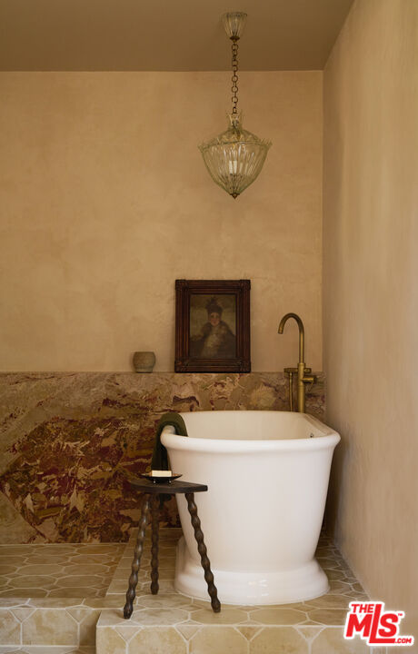 1764 East Orange Grove Boulevard Pasadena, CA 91104 - Photo 21 of 29 a view of a room with a table and chandelier