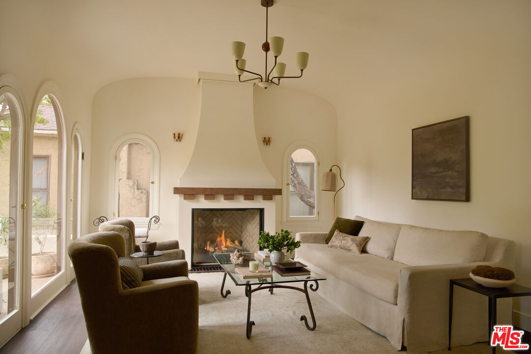 1764 East Orange Grove Boulevard Pasadena, CA 91104 - Photo 4 of 29 a living room with furniture and a fireplace