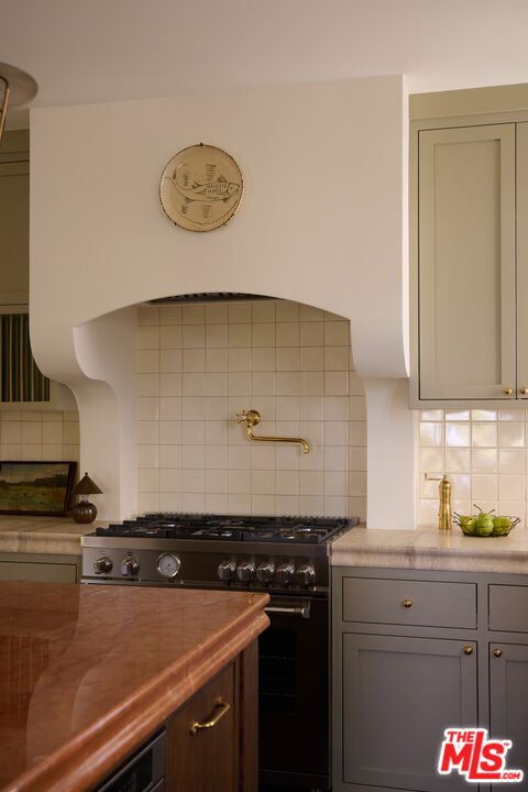 1764 East Orange Grove Boulevard Pasadena, CA 91104 - Photo 10 of 29 a stove top oven sitting inside of a kitchen