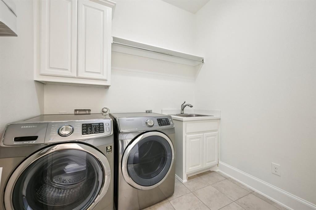 2029 Temperate Drive Allen, TX 75013 - Photo 21 of 40 a utility room with dryer and washer