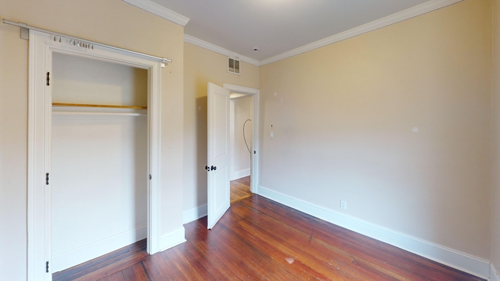 47 Iffley Road, Unit 3 Boston, MA 02130 - Photo 3 of 10 a view of empty room with wooden floor