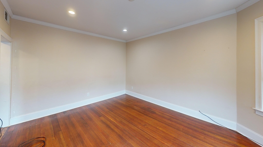 47 Iffley Road, Unit 3 Boston, MA 02130 - Photo 4 of 10 a view of room with wooden floor