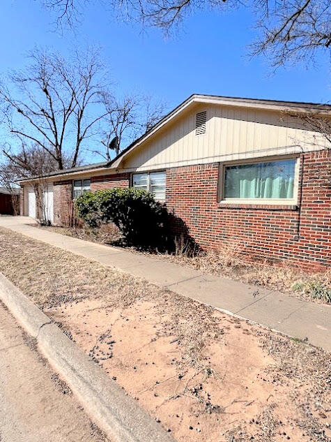 2801 57th Street Lubbock, TX 79413 - Photo 2 of 14 Corner view to back garage entrance