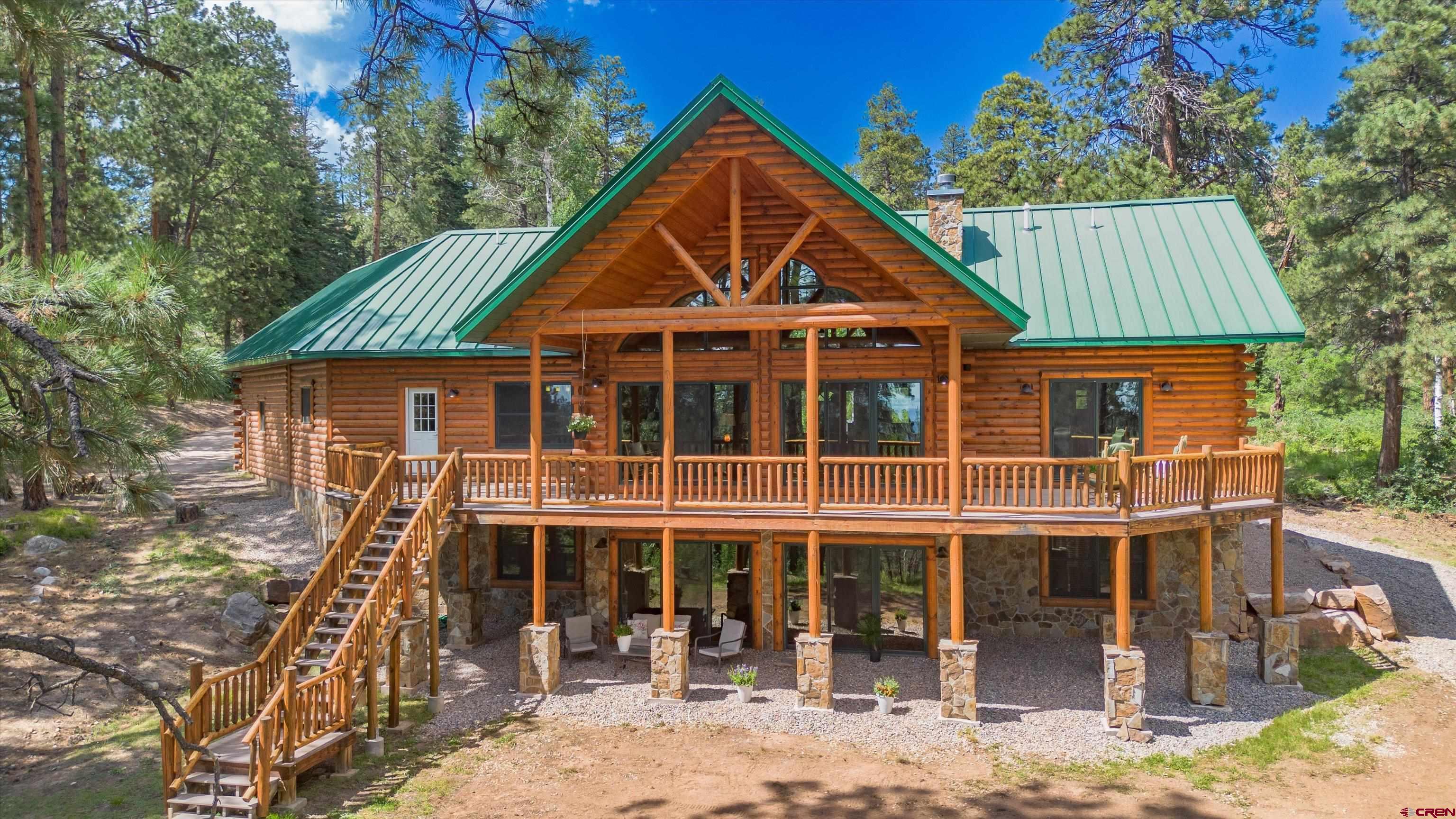 640 Clearview Road Durango, CO 81301 - Photo 1 of 40 a front view of a house with a yard