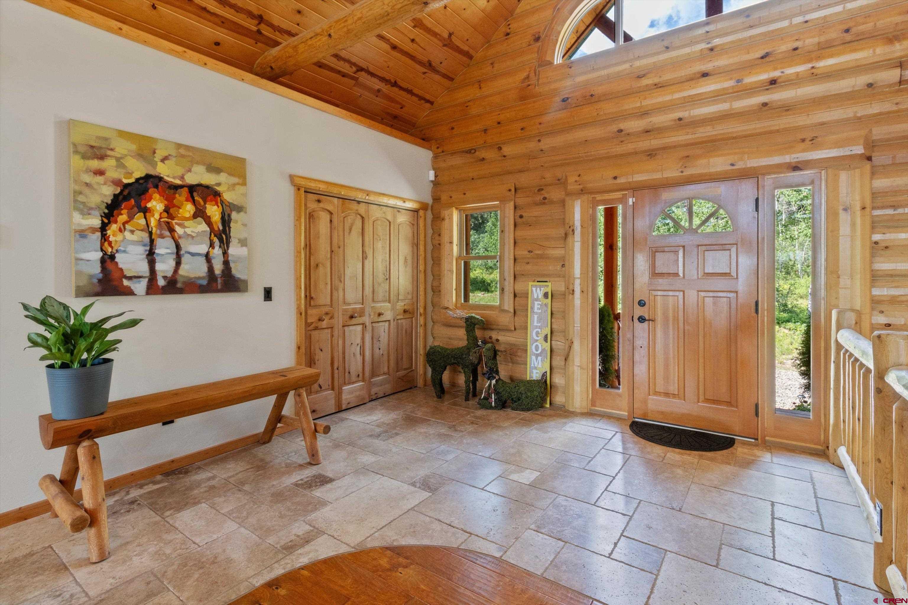 640 Clearview Road Durango, CO 81301 - Photo 13 of 40 a view of an entryway with a chandelier