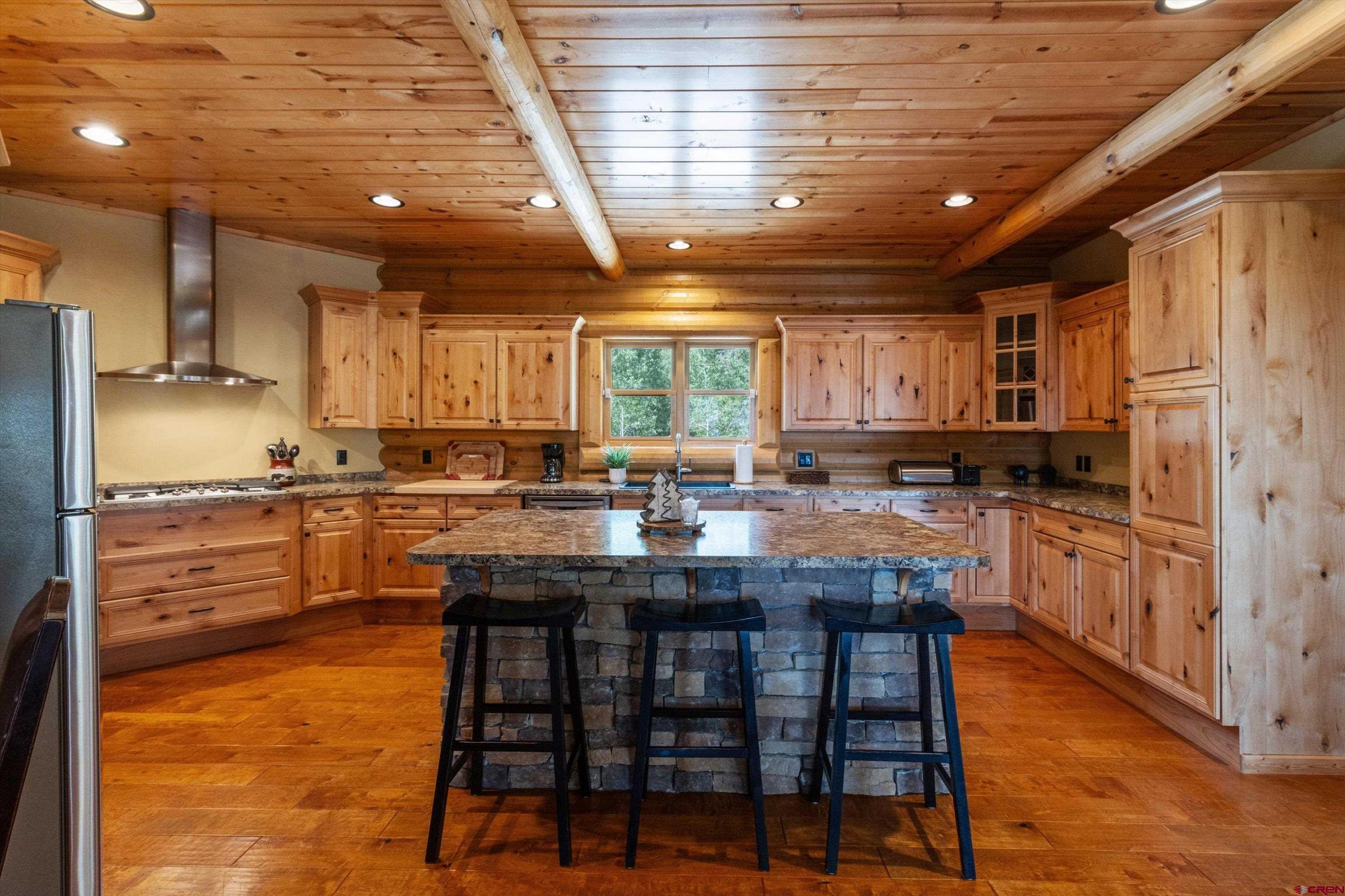 640 Clearview Road Durango, CO 81301 - Photo 2 of 40 a kitchen with stainless steel appliances granite countertop a stove sink and cabinets