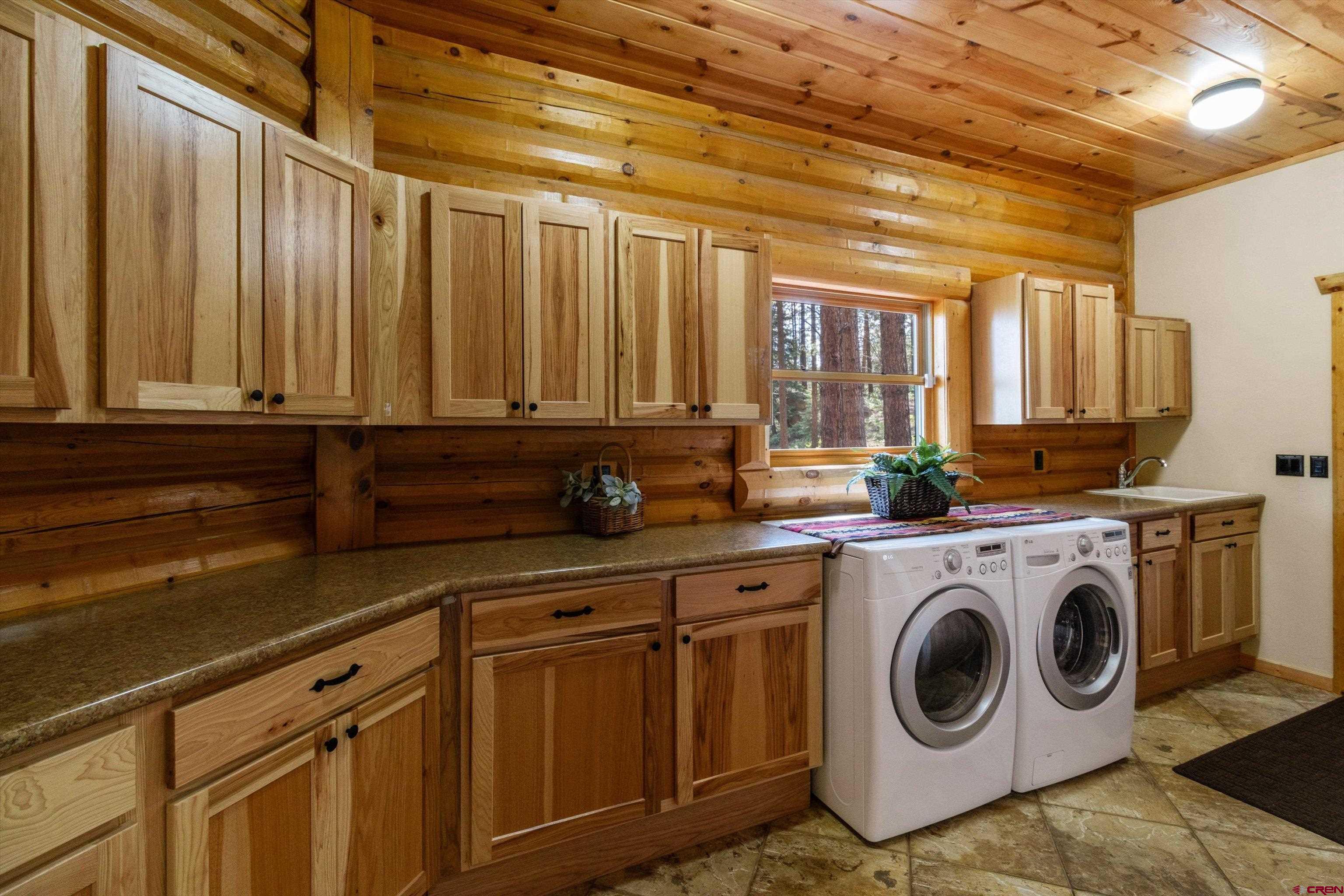 640 Clearview Road Durango, CO 81301 - Photo 21 of 40 a utility room with sink dryer and washer