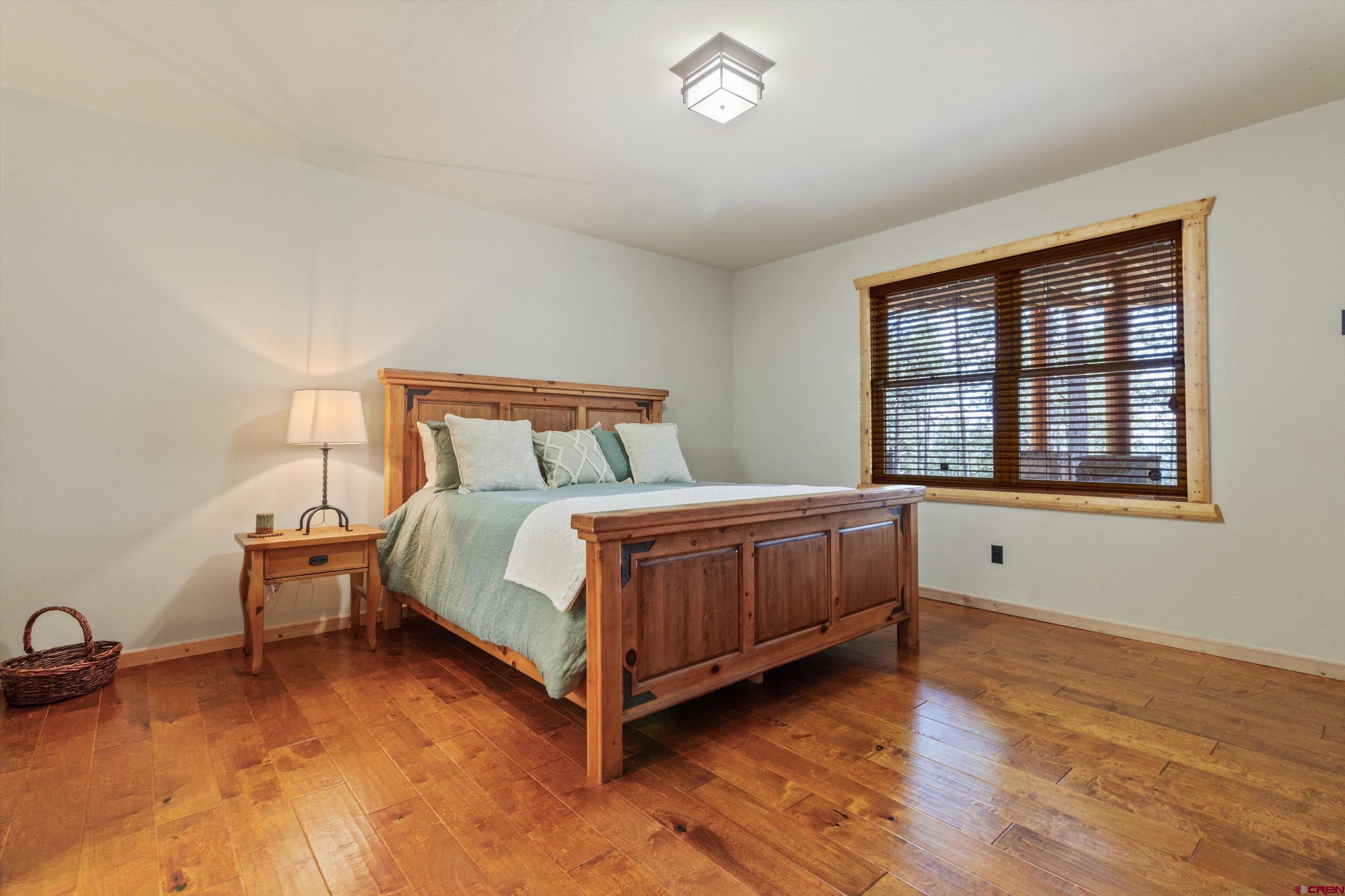 640 Clearview Road Durango, CO 81301 - Photo 22 of 40 a bed room with a bed and a window