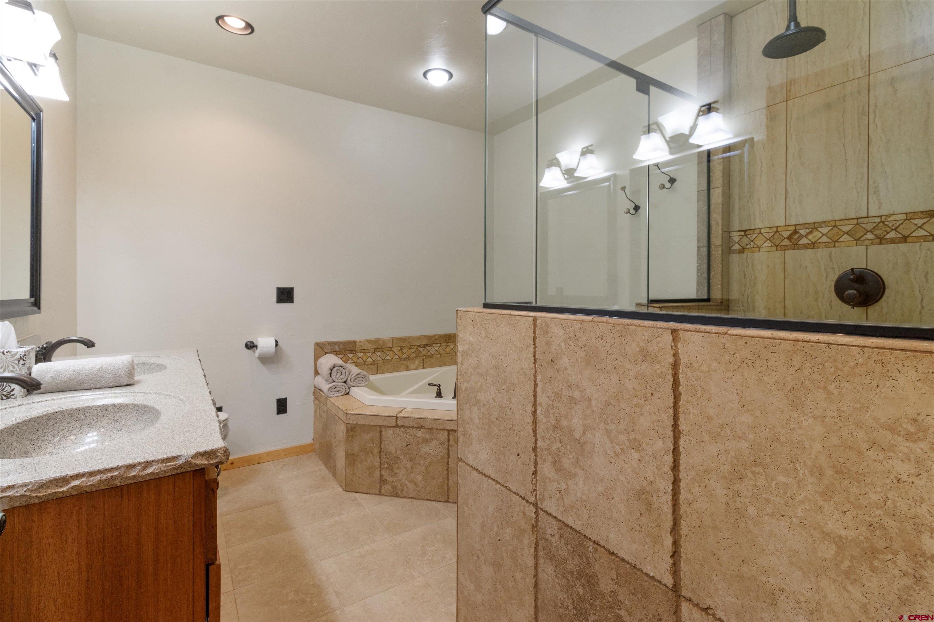 640 Clearview Road Durango, CO 81301 - Photo 23 of 40 a bathroom with a sink a toilet and shower
