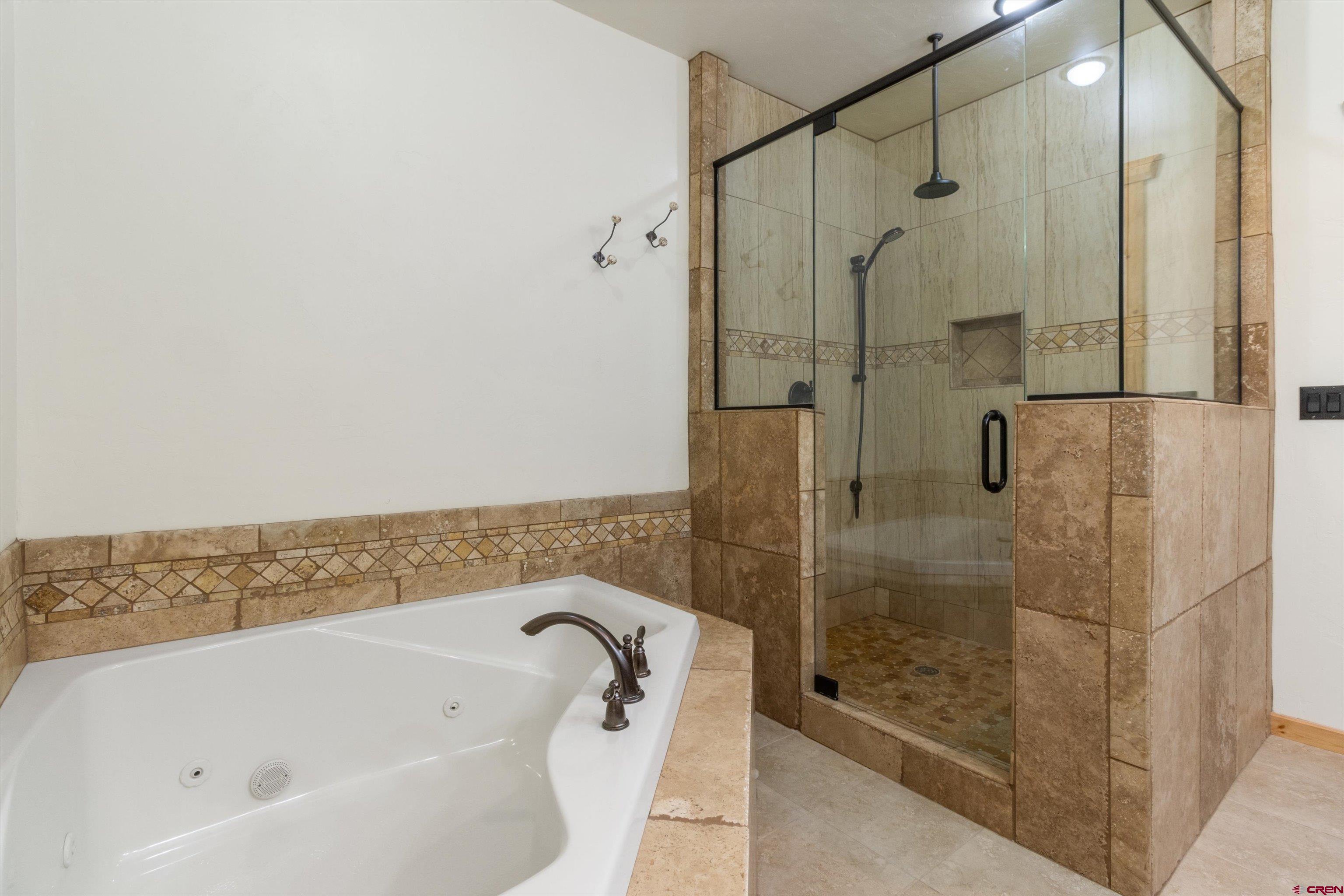640 Clearview Road Durango, CO 81301 - Photo 24 of 40 a bathroom with a bathtub and shower