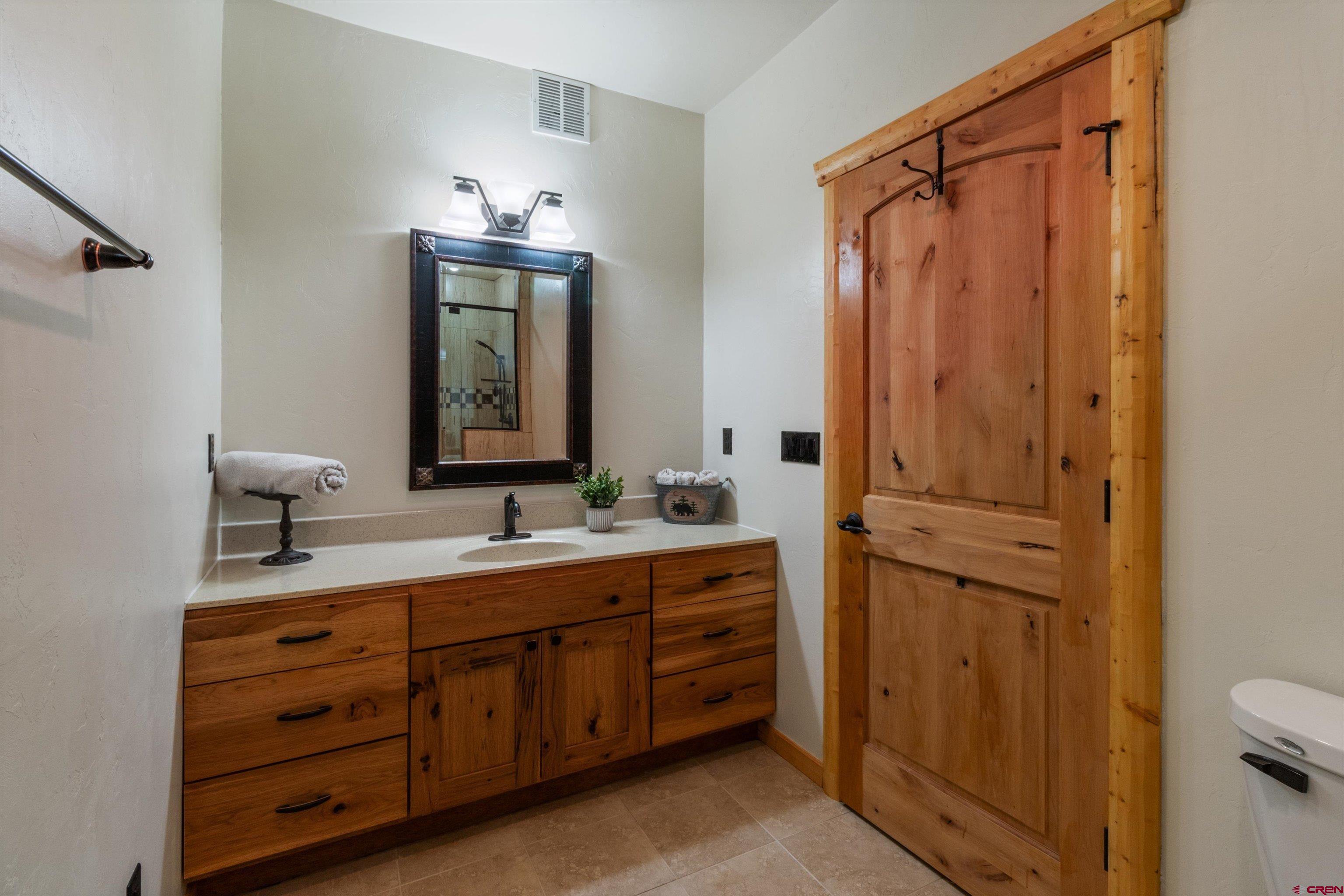 640 Clearview Road Durango, CO 81301 - Photo 27 of 40 a bathroom with a double vanity sink mirror and