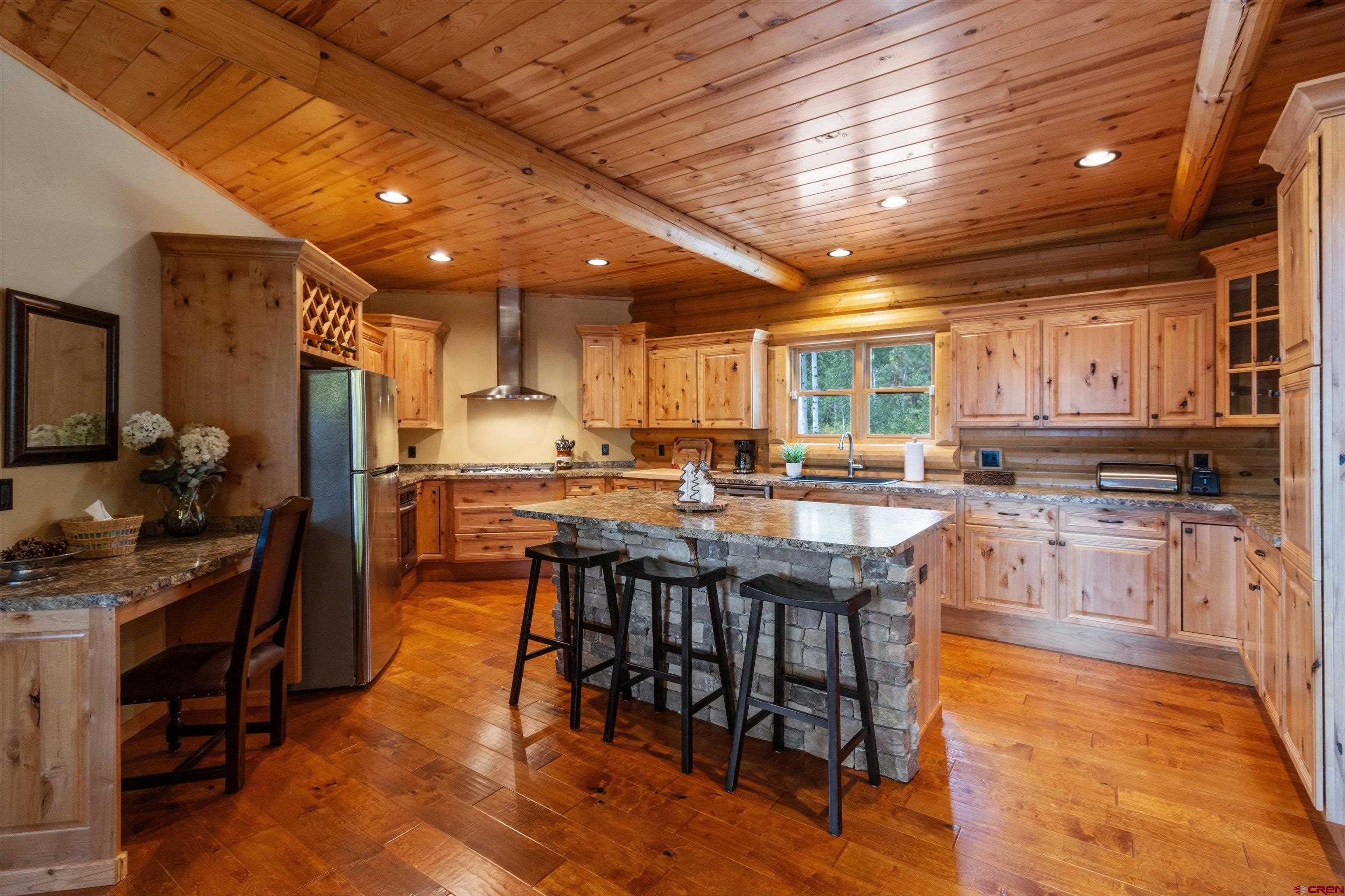 640 Clearview Road Durango, CO 81301 - Photo 3 of 40 a kitchen with stainless steel appliances granite countertop a stove refrigerator and cabinets