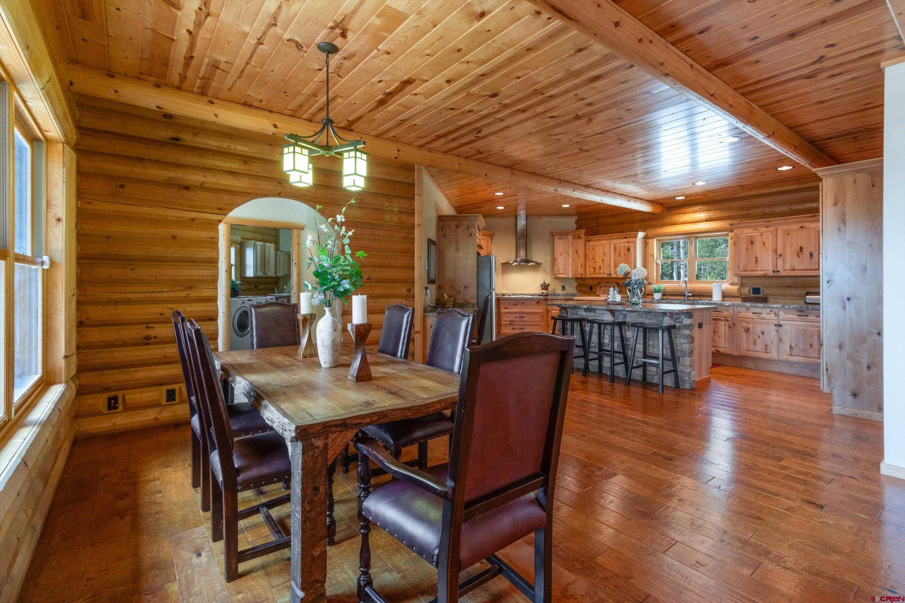 640 Clearview Road Durango, CO 81301 - Photo 6 of 40 a view of a dining room with furniture window and wooden floor