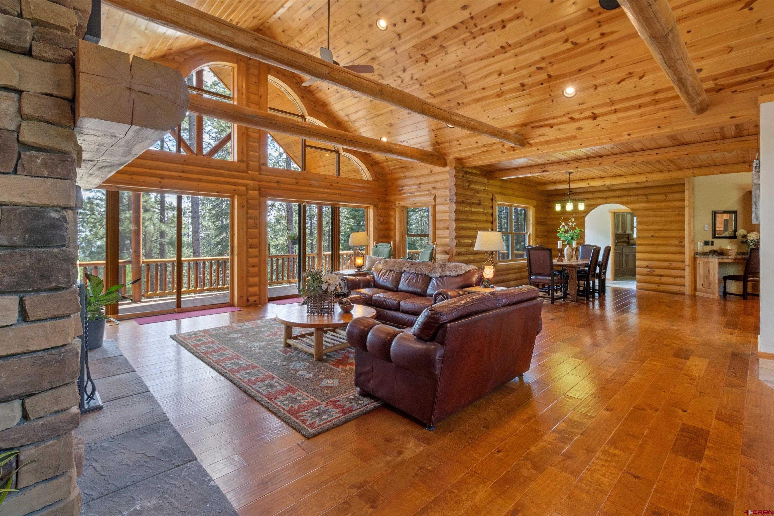 640 Clearview Road Durango, CO 81301 - Photo 7 of 40 a living room with furniture a wooden floor and next to a large window