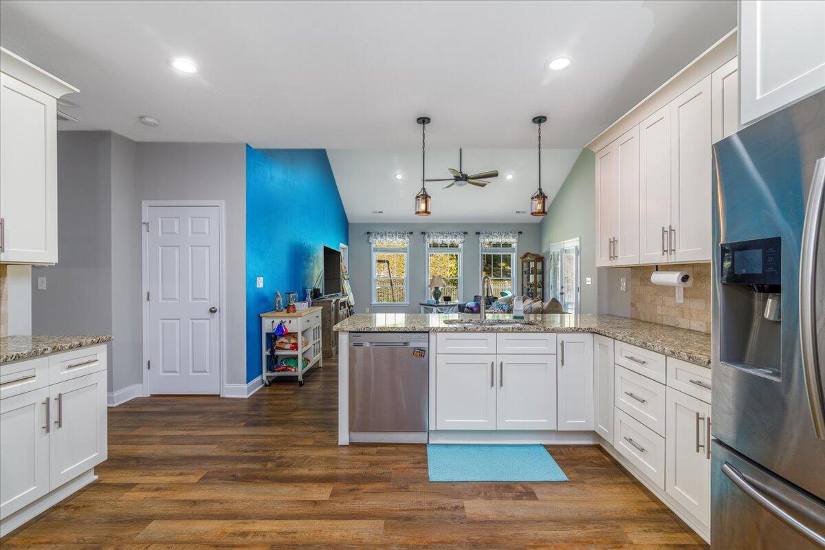 4277 Daugherty Road Salem, VA 24153 - Photo 11 of 48 a kitchen with stainless steel appliances granite countertop a sink refrigerator and cabinets