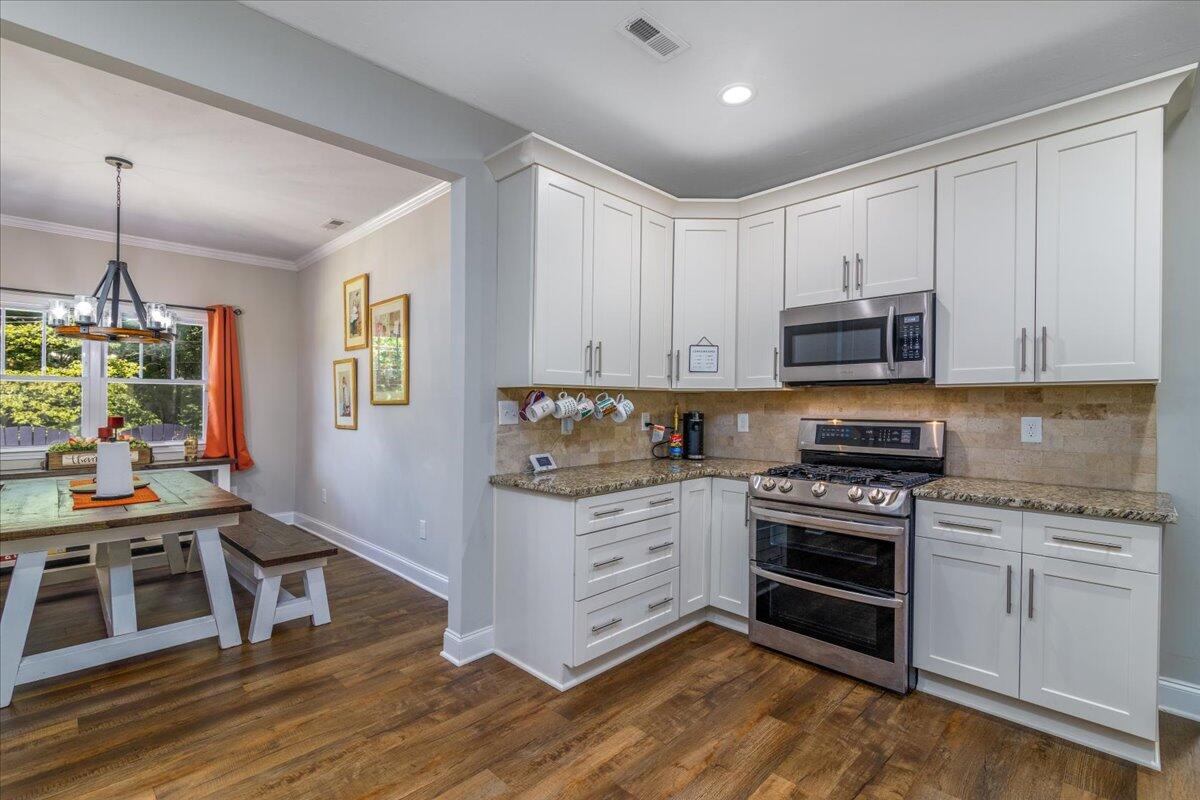 4277 Daugherty Road Salem, VA 24153 - Photo 12 of 48 a kitchen with stainless steel appliances granite countertop a stove a sink and a refrigerator