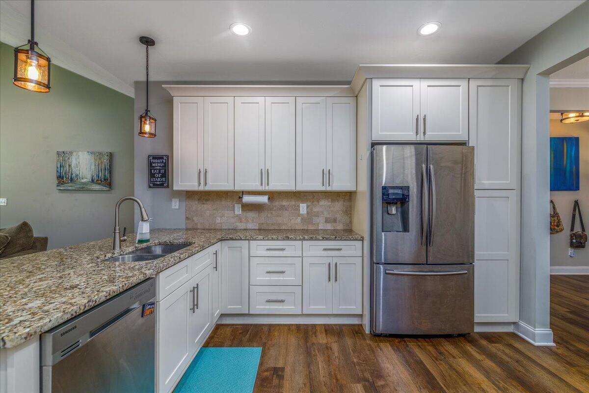 4277 Daugherty Road Salem, VA 24153 - Photo 13 of 48 a kitchen with granite countertop stainless steel appliances a refrigerator and cabinets